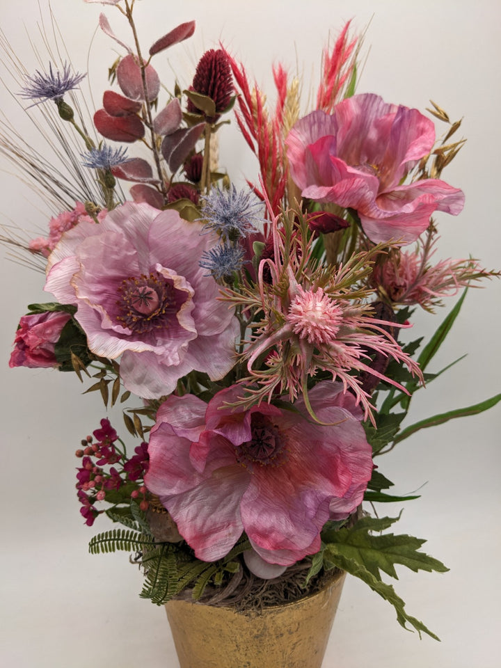 Sommergesteck Schnecke Mohn Distel Gräser rosa