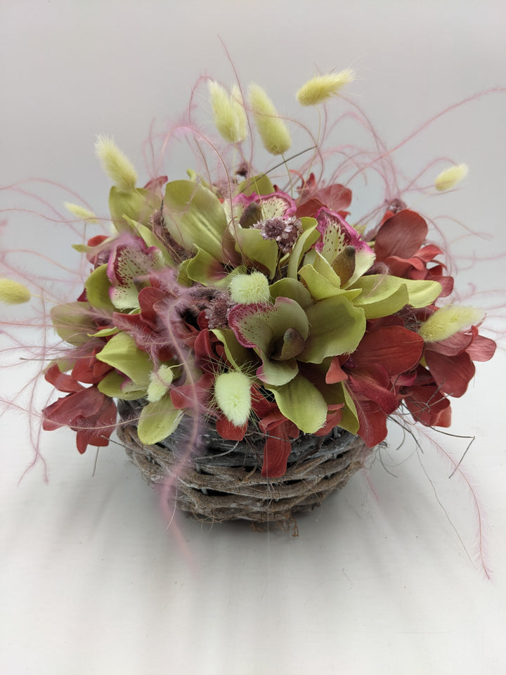 Sommergesteck Feder Orchidee rosa