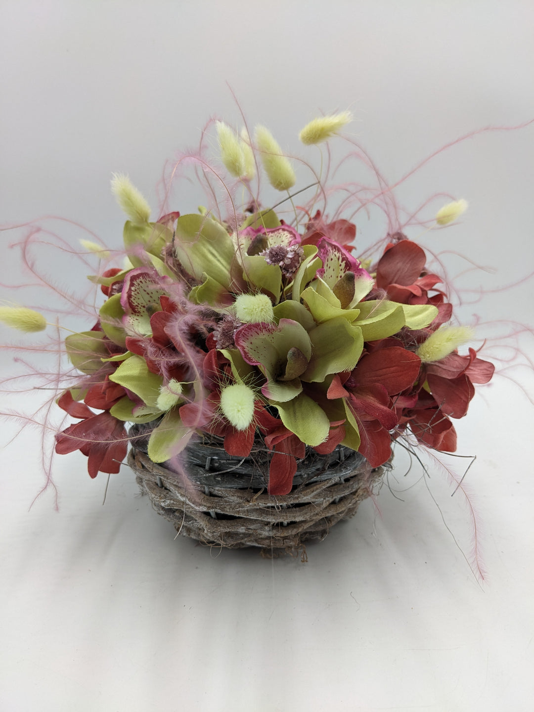 Sommergesteck Feder Orchidee rosa