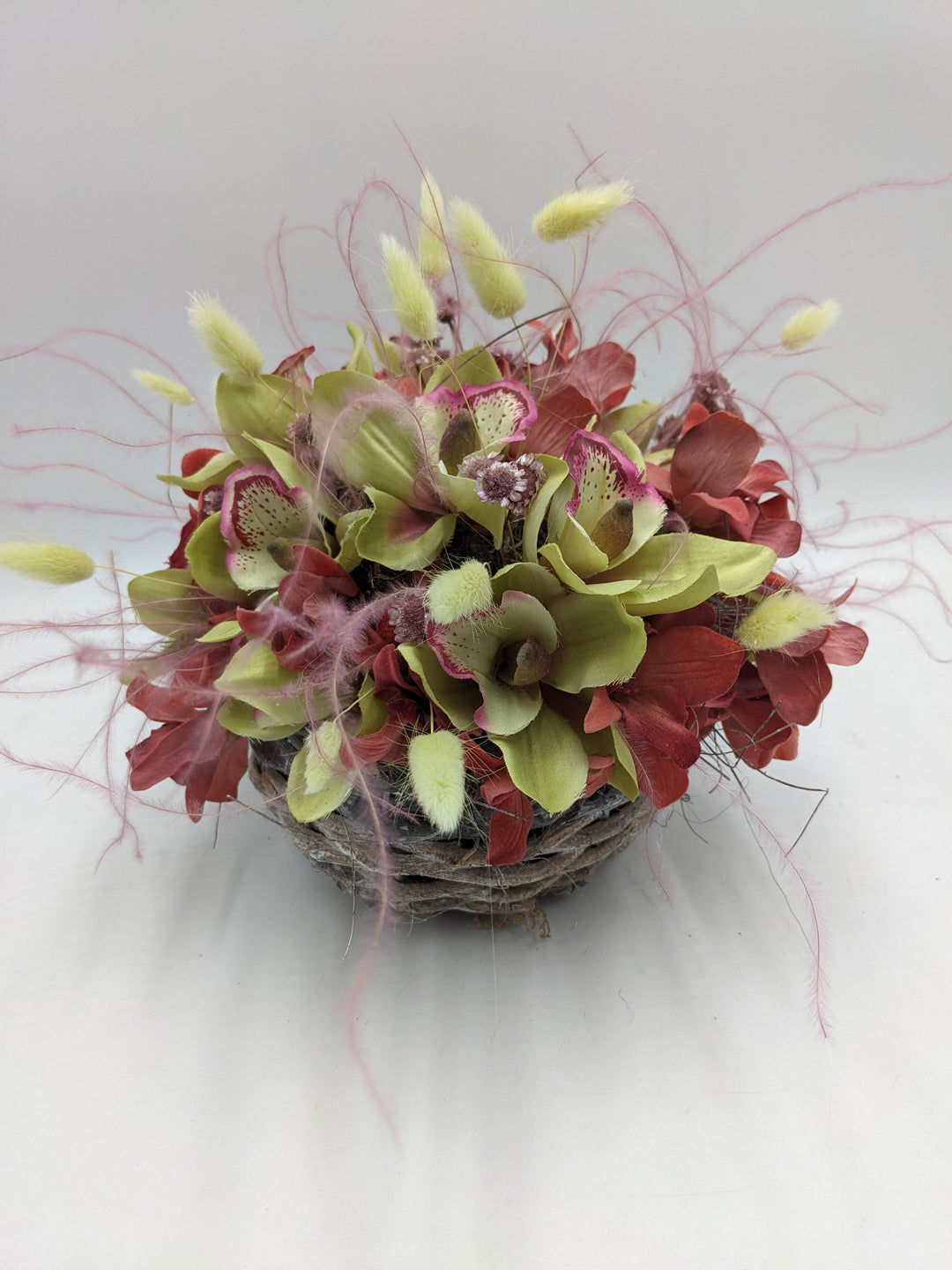 Sommergesteck Feder Orchidee rosa