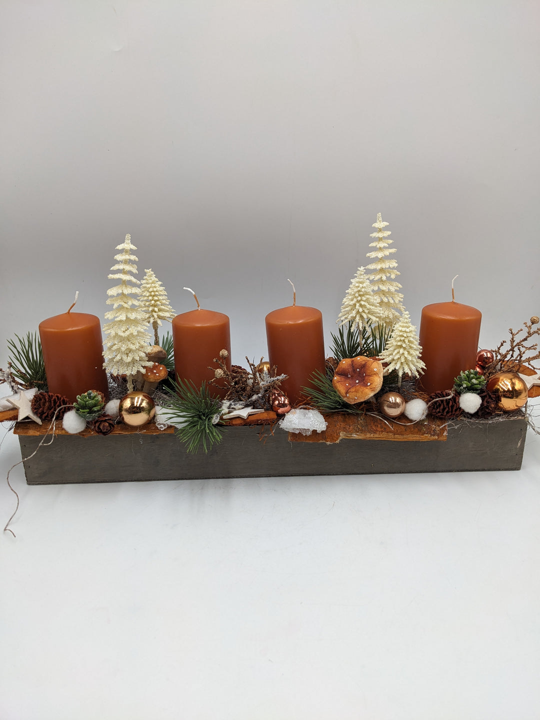 Adventsgesteck Kugel Pilz Stern orange