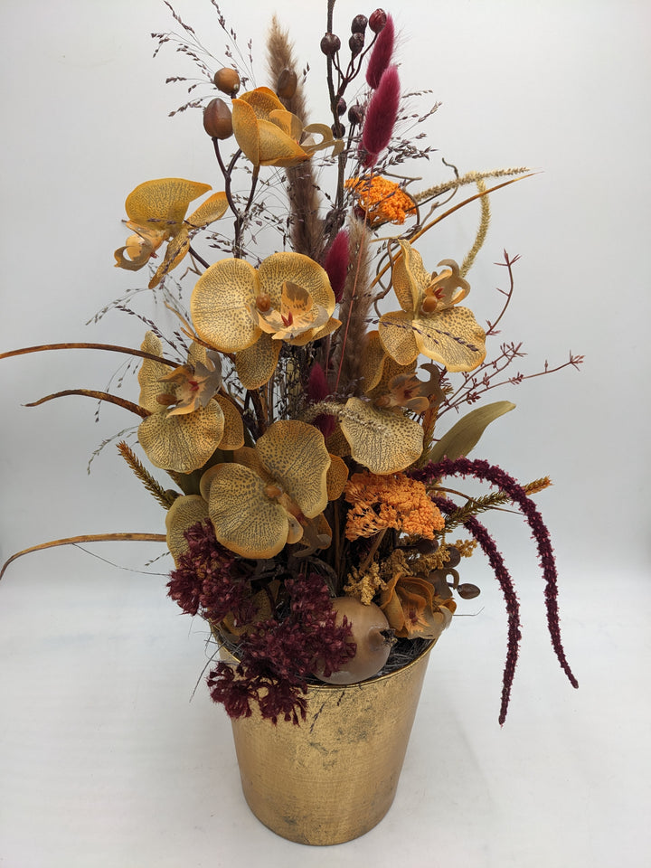 Herbstgesteck Orchidee Blüten orange