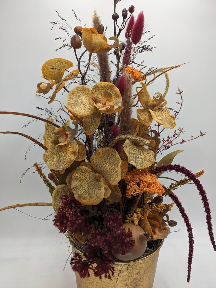 Herbstgesteck Orchidee Blüten orange