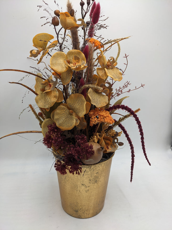 Herbstgesteck Orchidee Blüten orange