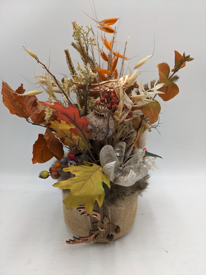 Herbstgesteck Vogel Hirschkopf Laub rot