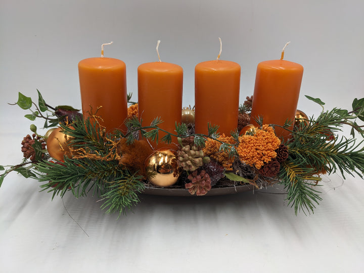 Adventsgesteck Kugel Zapfen Stern orange