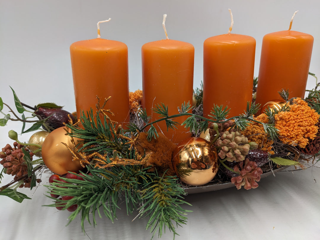 Adventsgesteck Kugel Zapfen Stern orange