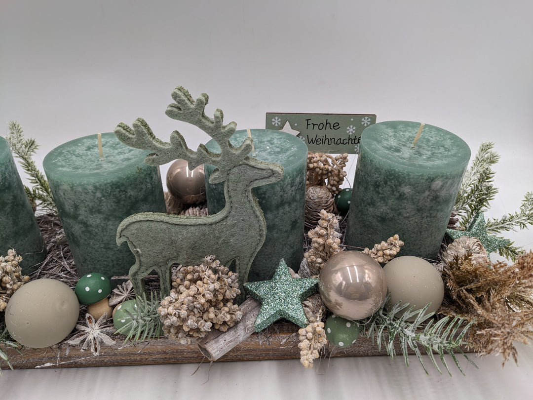 Adventsgesteck Frohe Weihnachten Kugel Hirsch mint