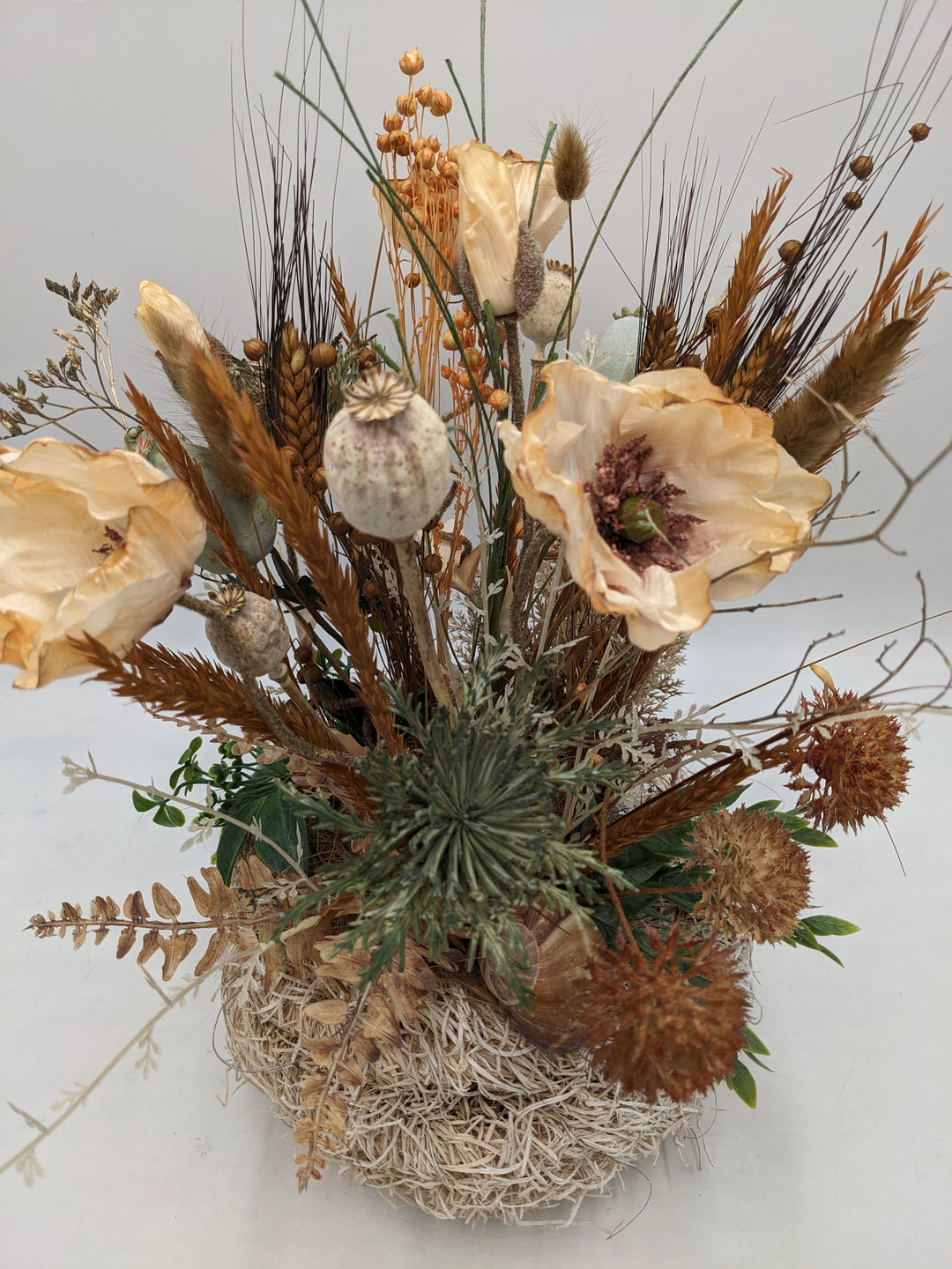 Herbstgesteck Mohn Gräser Schnecke apricote