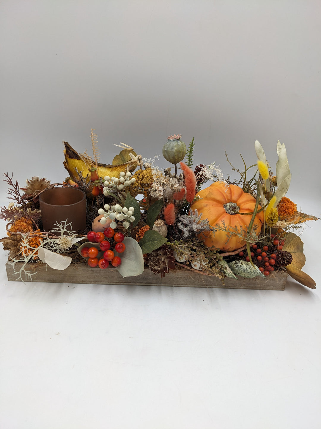 Herbstgesteck Kürbis Teelicht orange