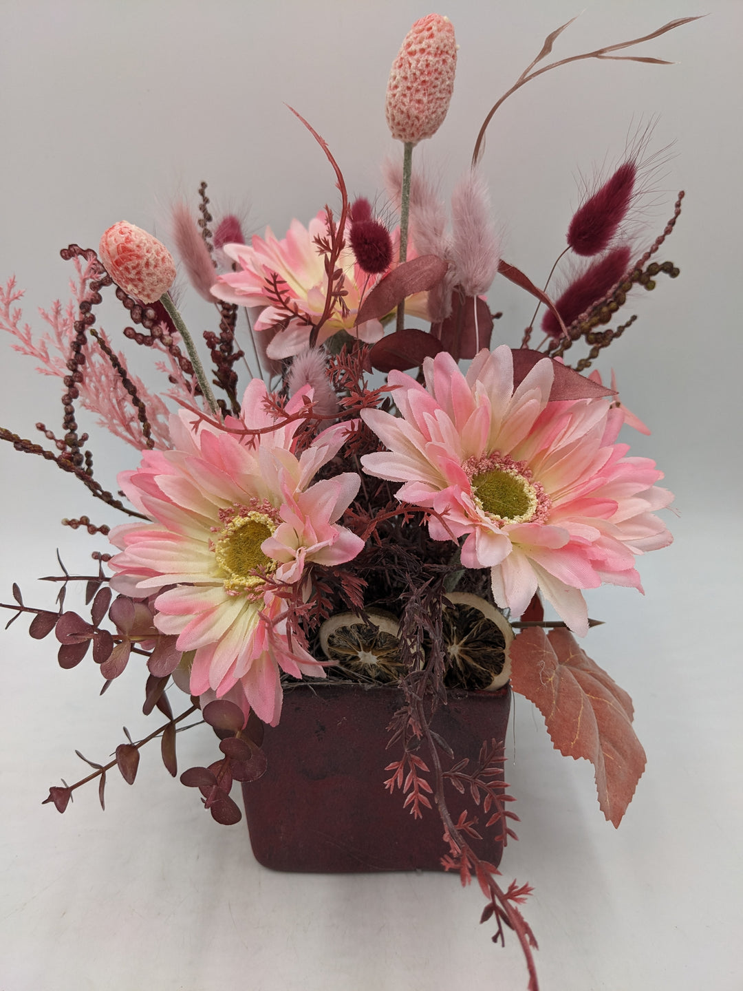 Frühlingsgesteck Gräser rot rosa