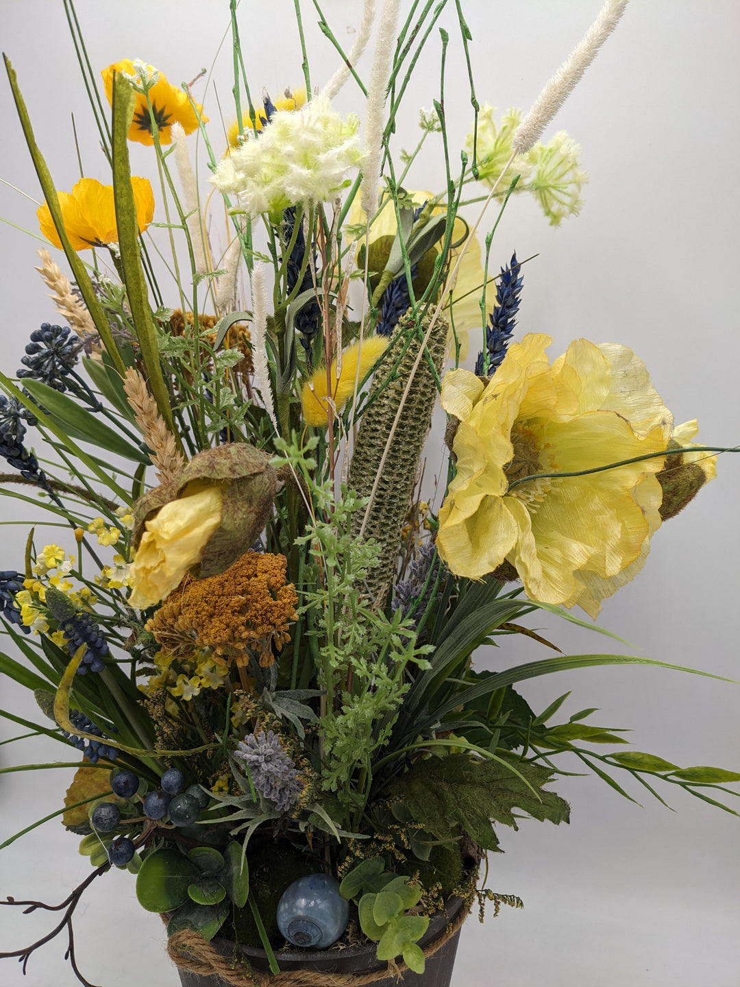 Frühlingsgesteck Gräser Hyazinthen gelb blau