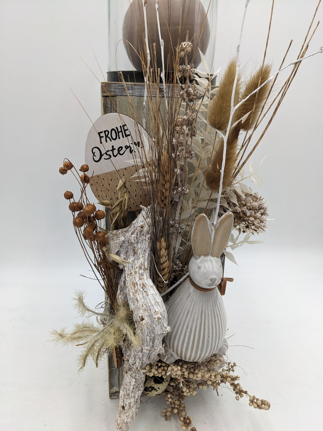 Ostergesteck Frühlingsgesteck Gräser Hase Kerze natur