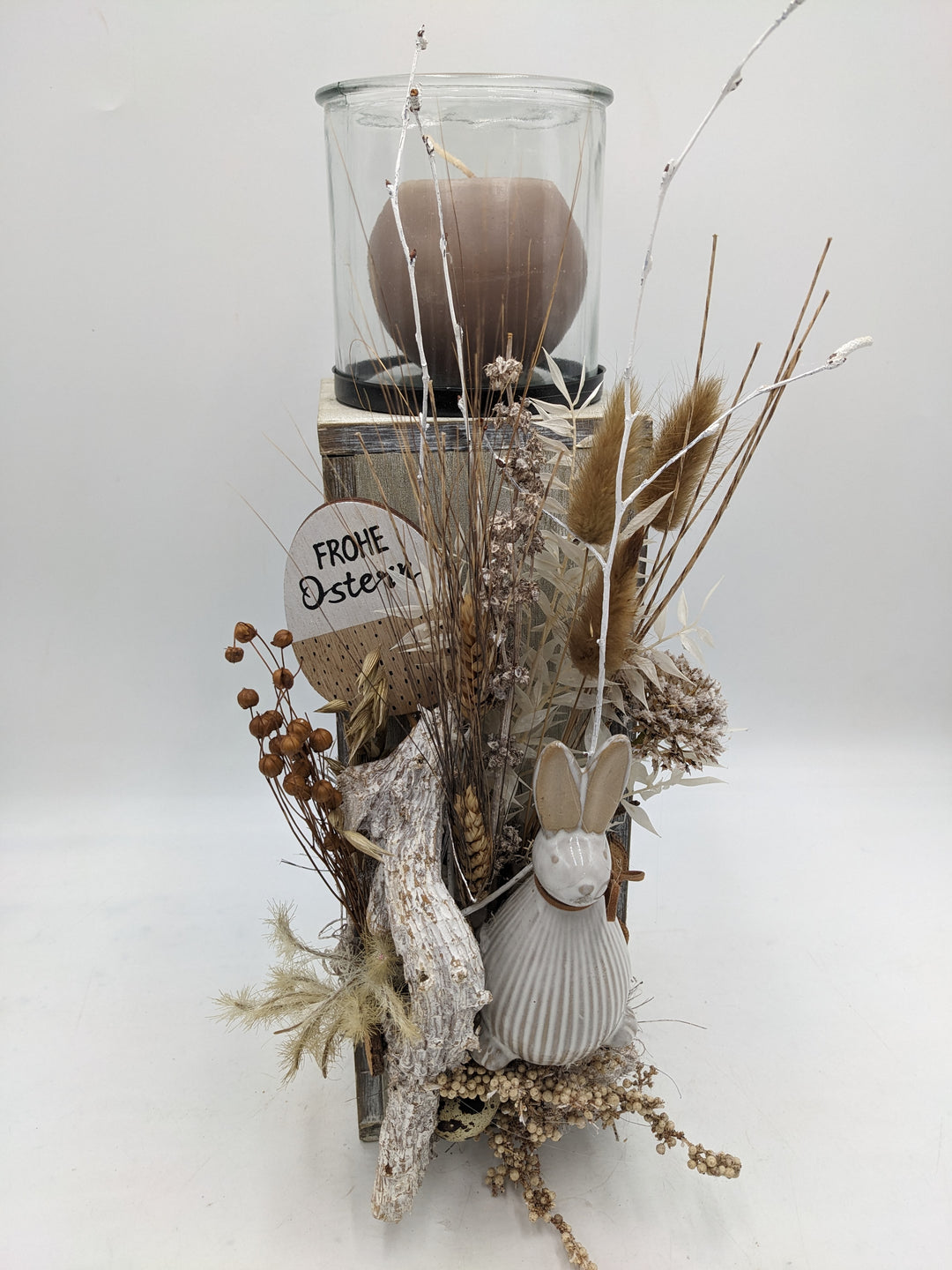 Ostergesteck Frühlingsgesteck Gräser Hase Kerze natur