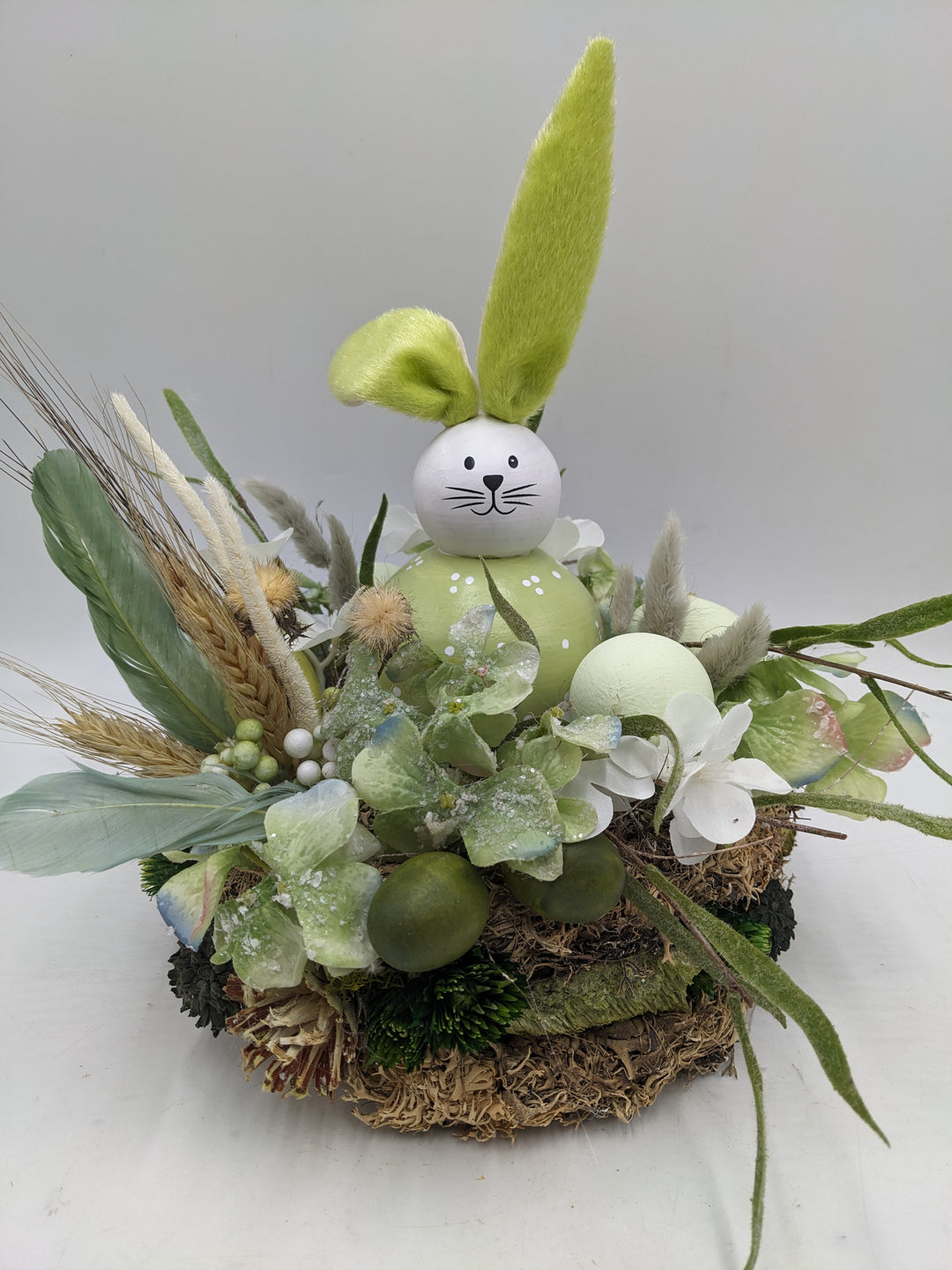 Ostergesteck Frühlingsgesteck Hase Gräser Eier grün