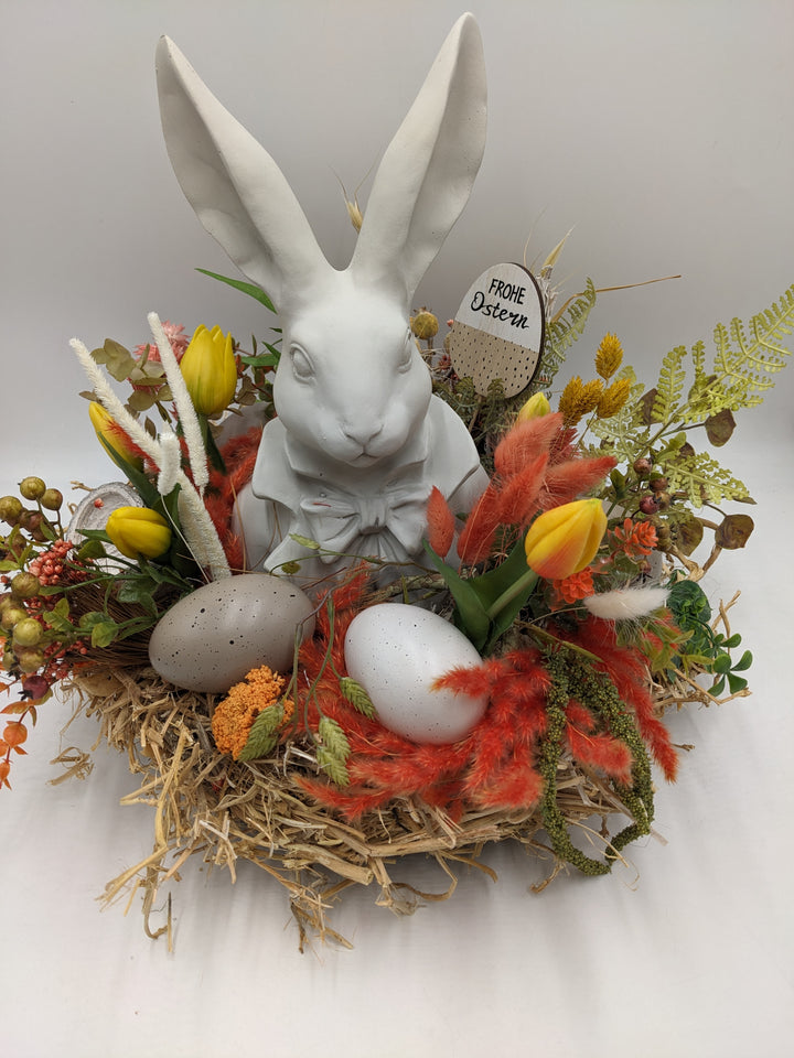 Ostergesteck Frühlingsgesteck Nase Gräser Tulpen orange gelb