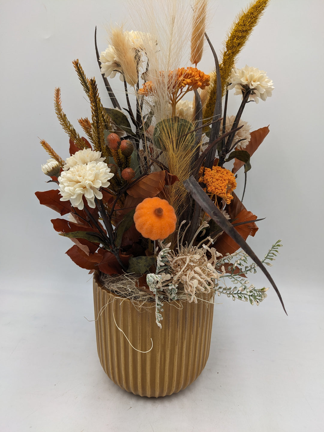 Herbstgesteck Kürbis Gräser orange creme