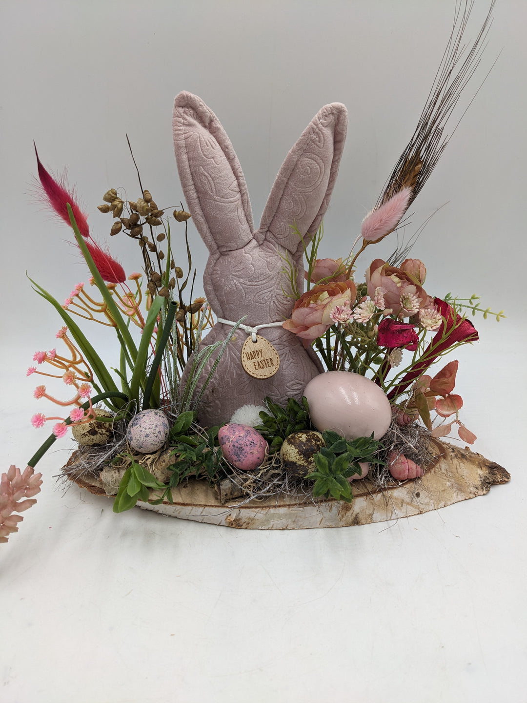 Ostergesteck Frühlingsgesteck Gräser Ranunkel rosa