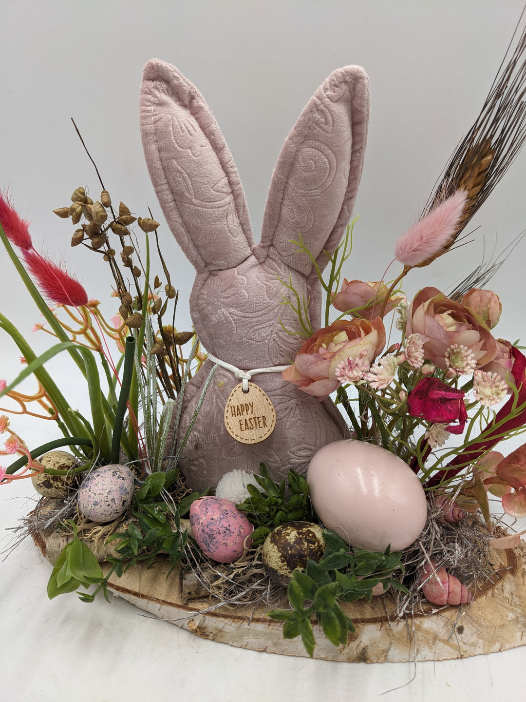 Ostergesteck Frühlingsgesteck Gräser Ranunkel rosa