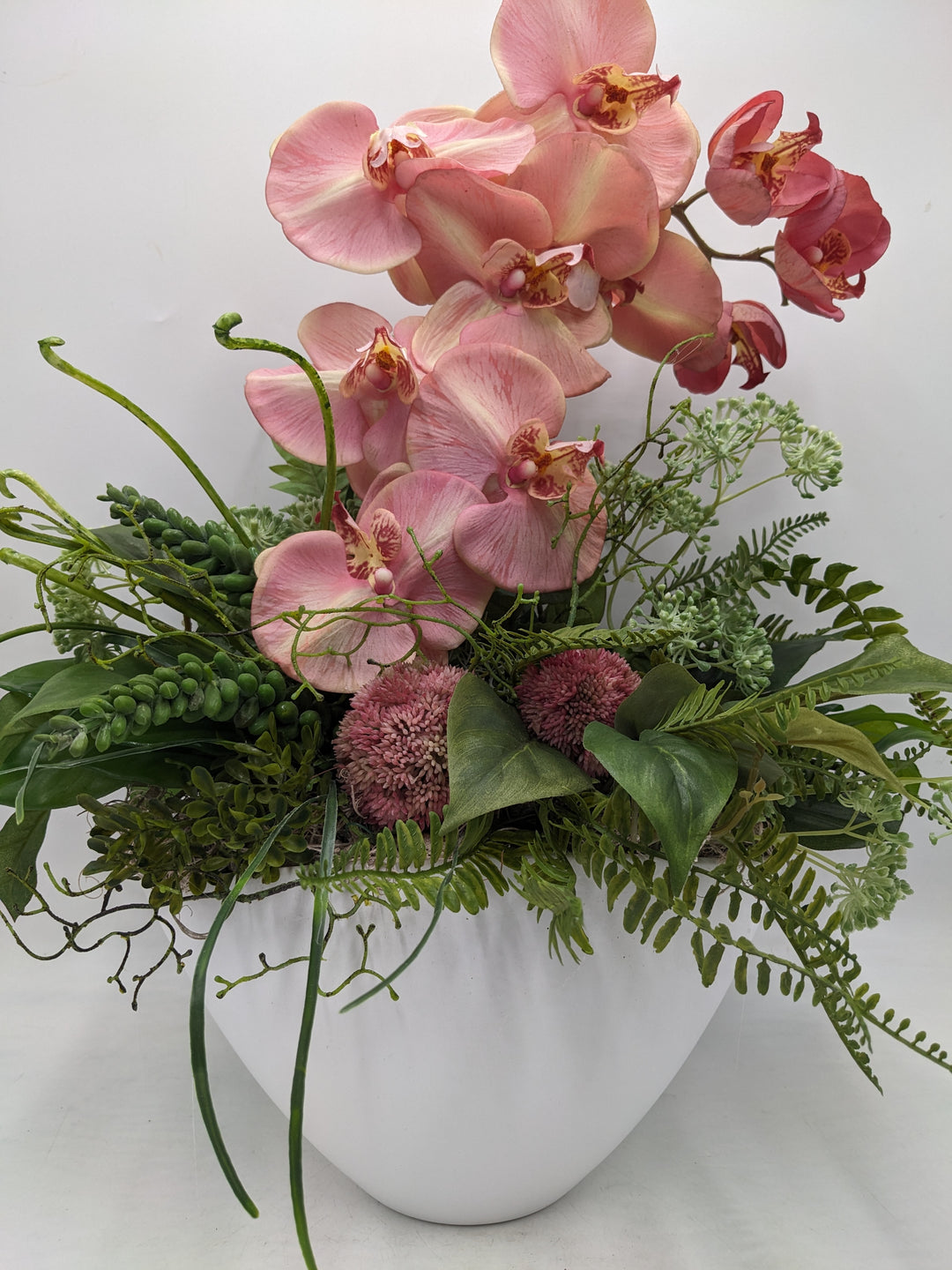 Frühlingsgesteck Orchideen Sedum rosa