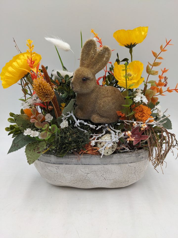 Ostergesteck Frühlingsgesteck Hase Gräser gelb orange