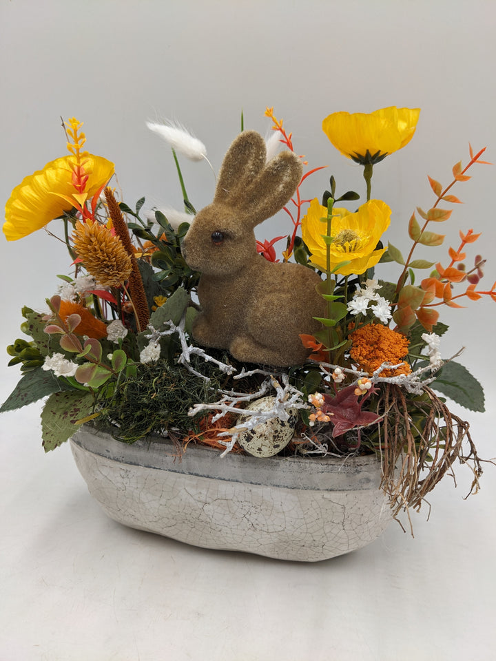 Ostergesteck Frühlingsgesteck Hase Gräser gelb orange