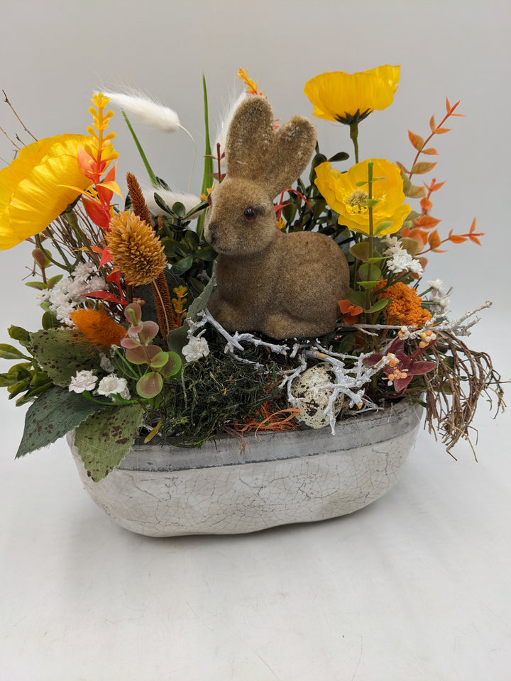 Ostergesteck Frühlingsgesteck Hase Gräser gelb orange