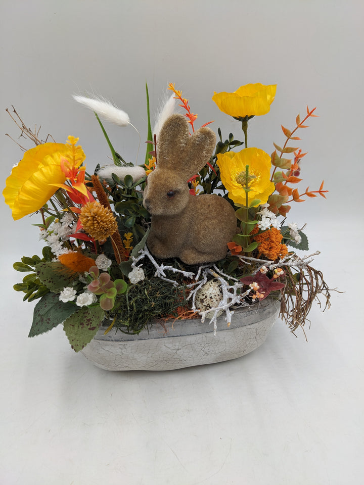 Ostergesteck Frühlingsgesteck Hase Gräser gelb orange