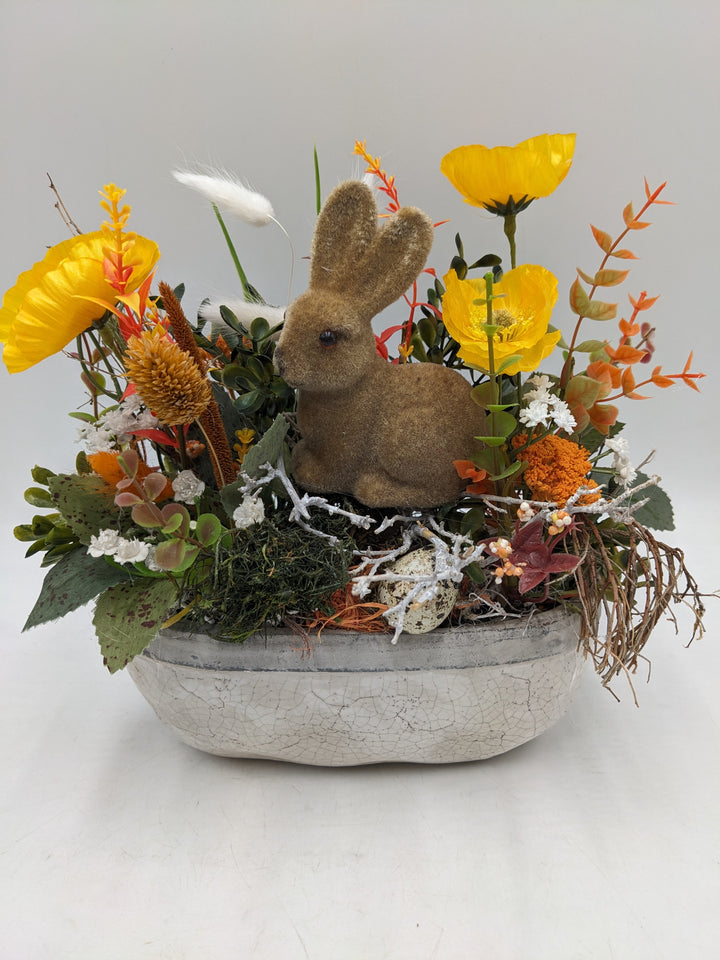 Ostergesteck Frühlingsgesteck Hase Gräser gelb orange