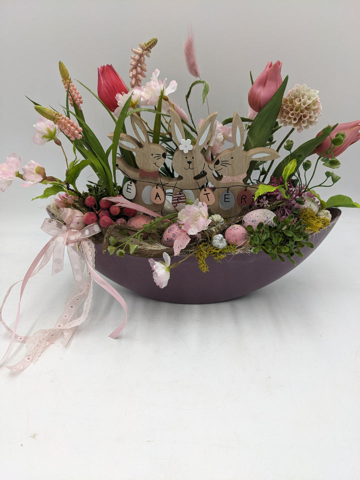 Ostergesteck Frühlingsgesteck Tulpen Gräser Eier rosa