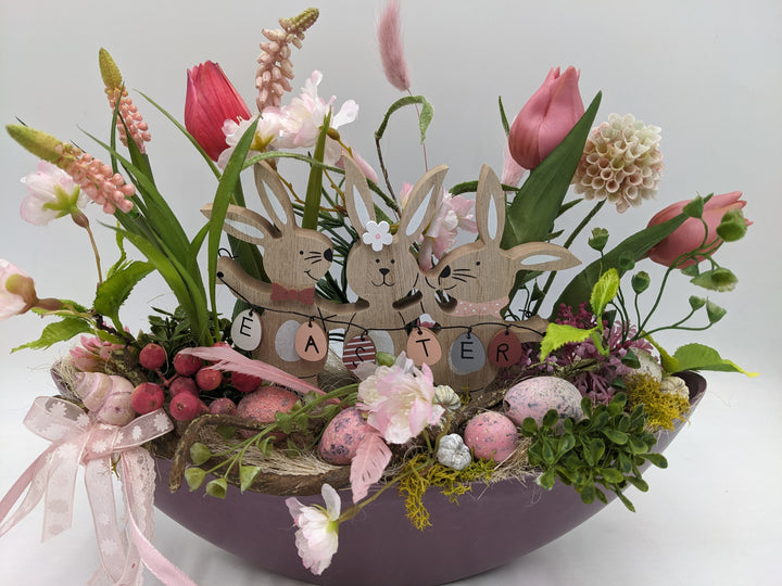 Ostergesteck Frühlingsgesteck Tulpen Gräser Eier rosa