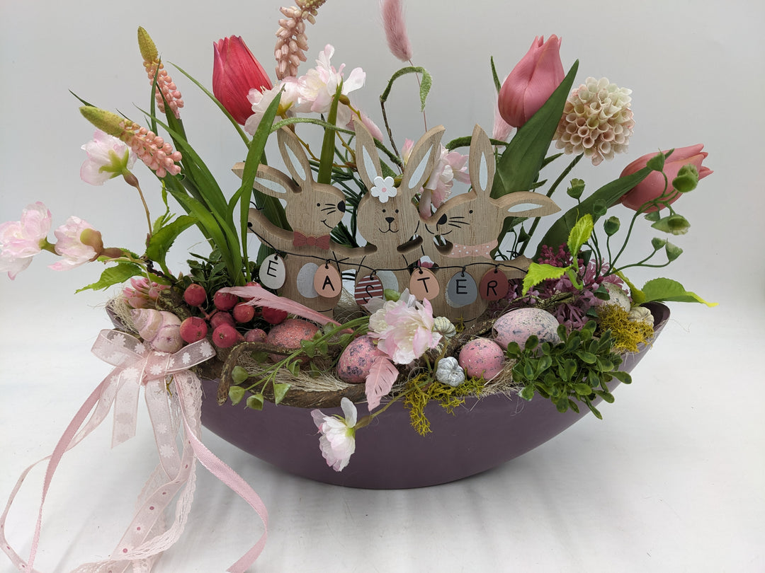 Ostergesteck Frühlingsgesteck Tulpen Gräser Eier rosa