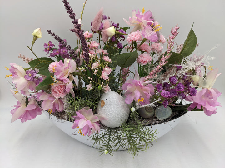 Frühlingsgesteck Vogel Gräser rosa lila