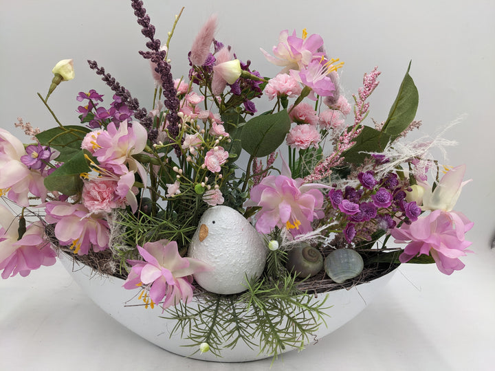 Frühlingsgesteck Vogel Gräser rosa lila