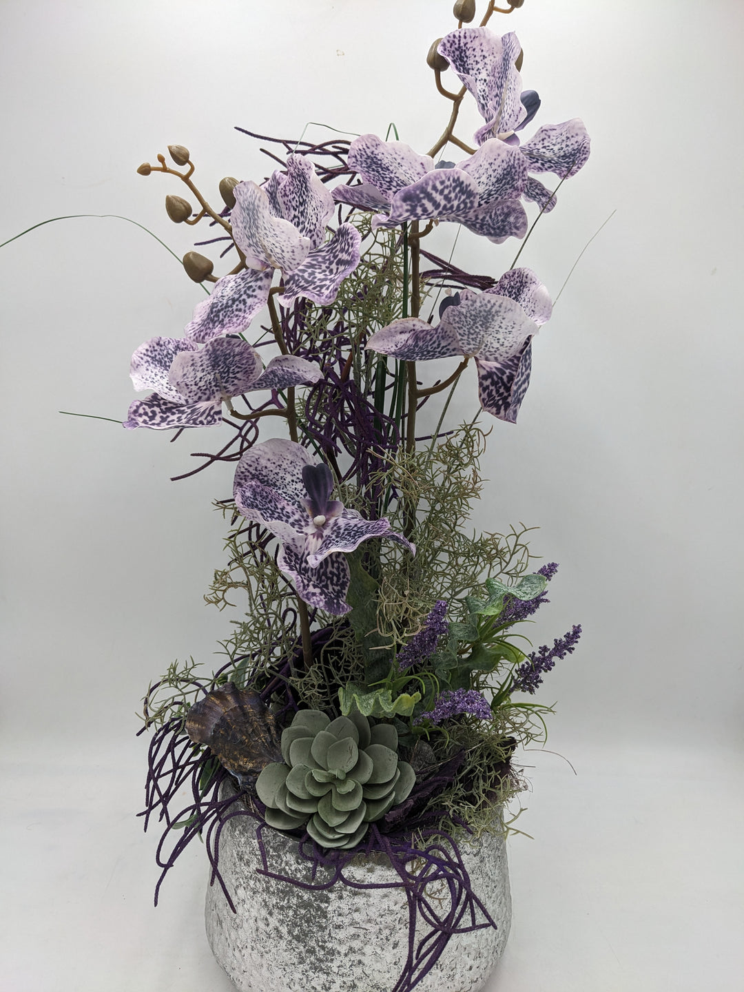 Frühlingsgesteck Orchideen silber lila