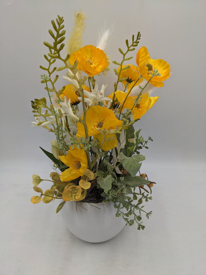 Frühlingsgesteck Mohnblumen Gräser Tulpen gelb
