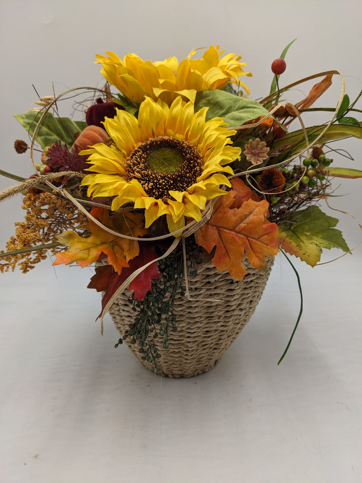 Herbstgesteck Sonnenblume Kürbisse orange gelb