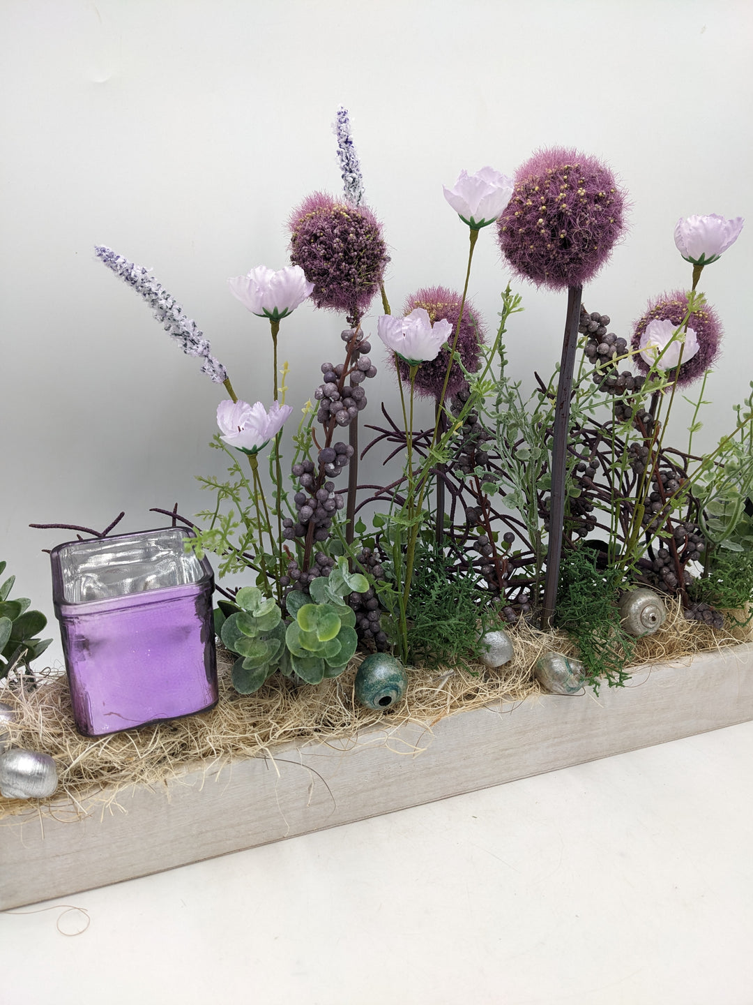 Frühlingsgesteck Teelicht Wiesenblumen lila