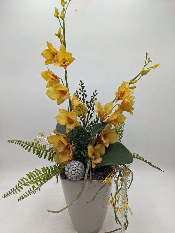 Frühlingsgesteck Orchidee gelb Faru grau