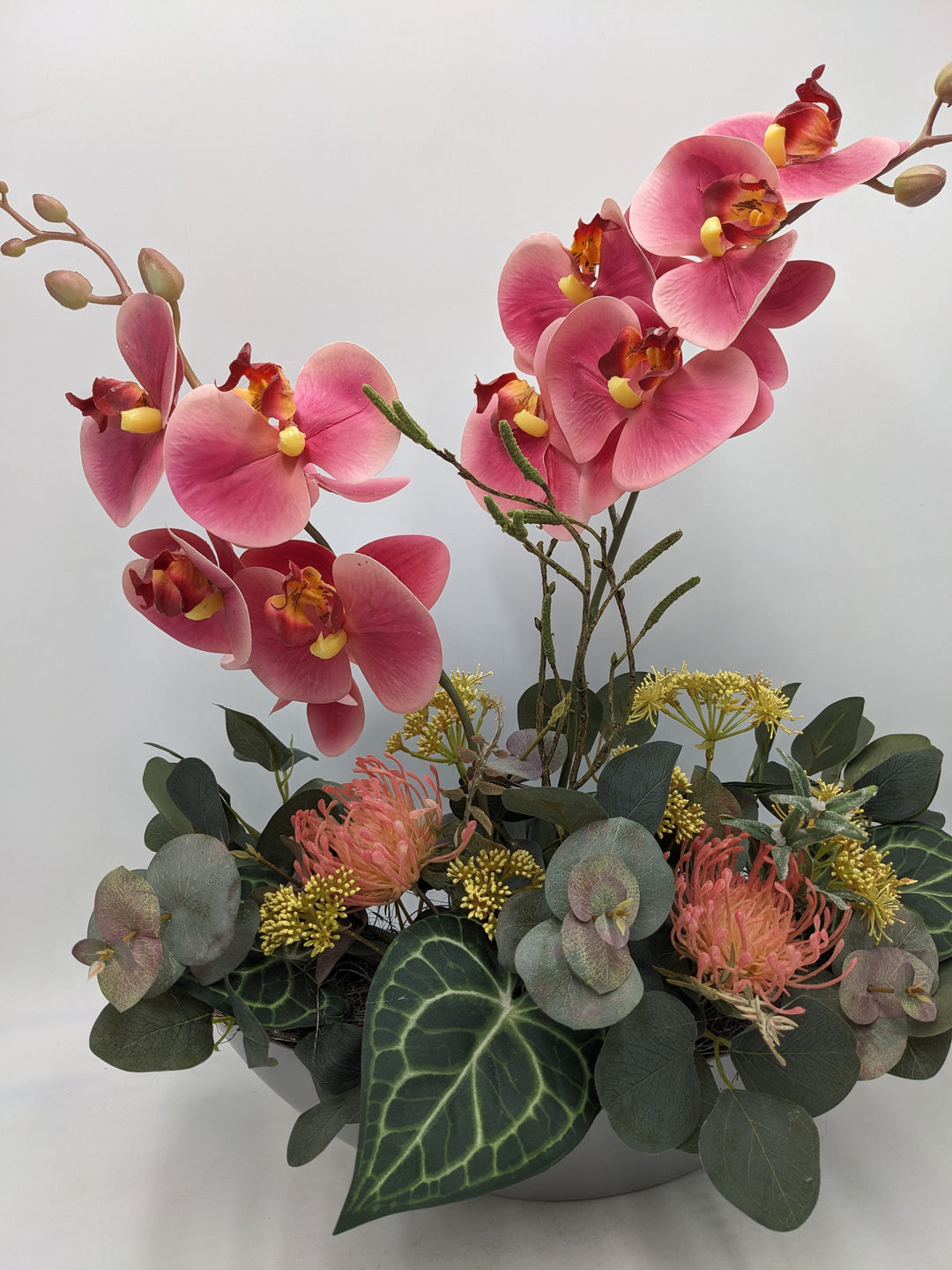 Frühlingsgesteck Orchidee Eukalyptus rosa grau