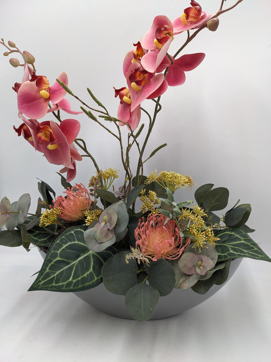 Frühlingsgesteck Orchidee Eukalyptus rosa grau