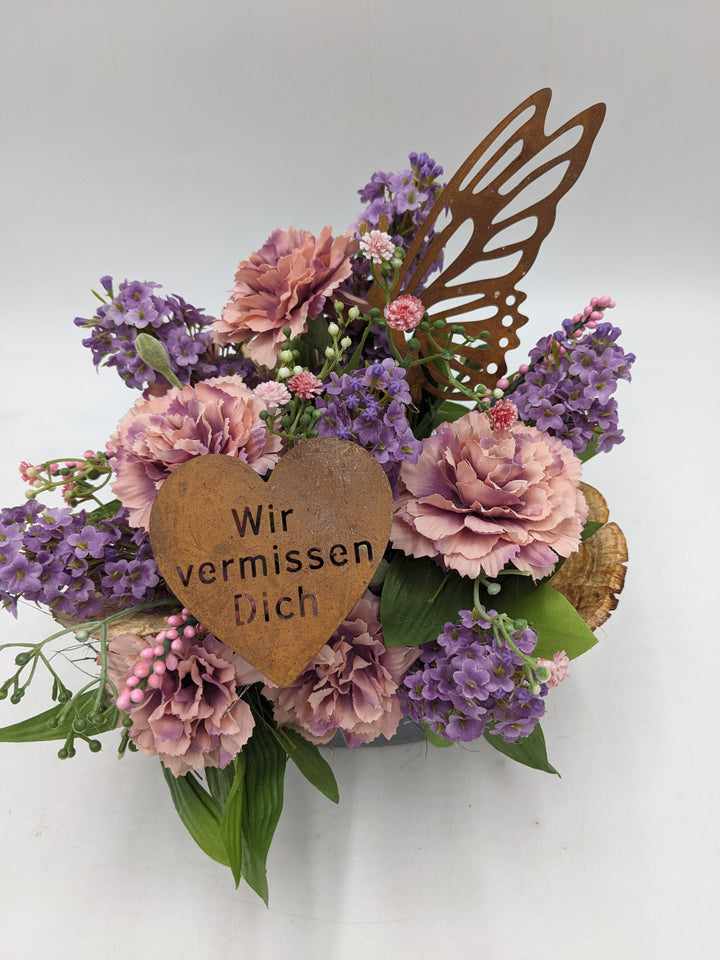 Trauergesteck Flieder Nelken rosa lila