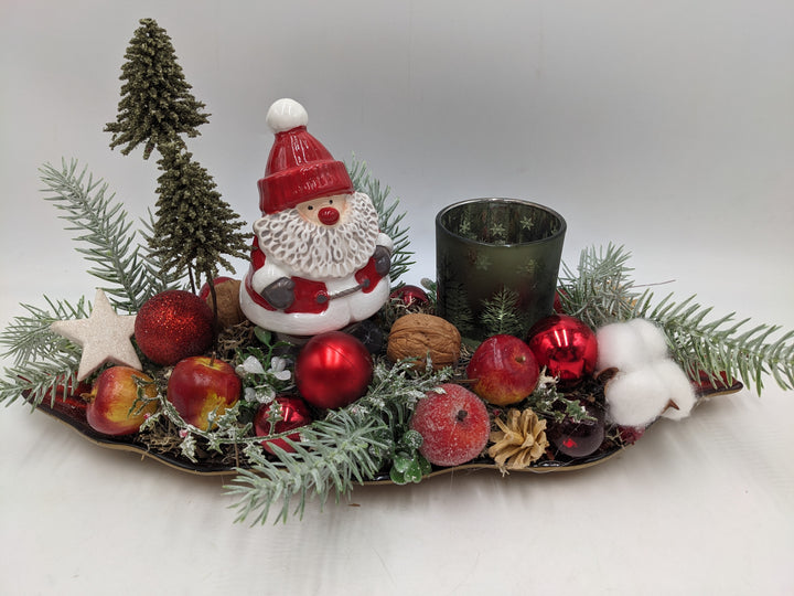 Weihnachtsgesteck Teelicht Äpfel Weihnachtsmann Bäume