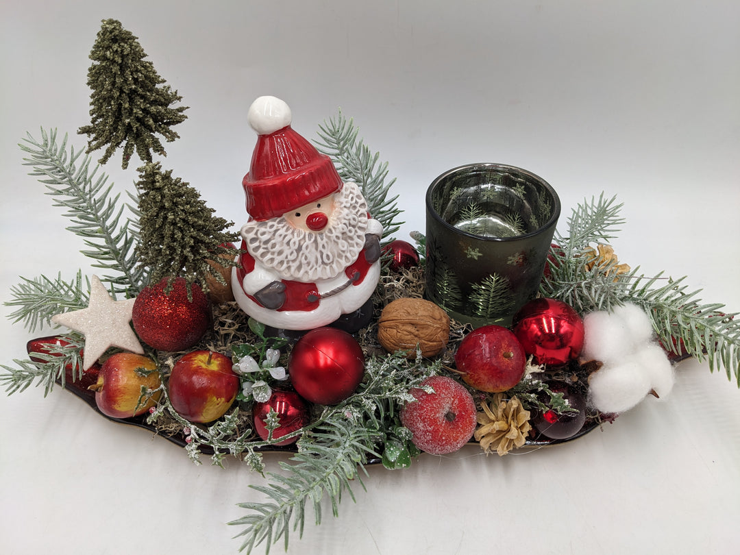 Weihnachtsgesteck Teelicht Äpfel Weihnachtsmann Bäume