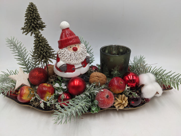 Weihnachtsgesteck Teelicht Äpfel Weihnachtsmann Bäume