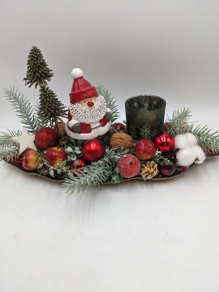 Weihnachtsgesteck Teelicht Äpfel Weihnachtsmann Bäume