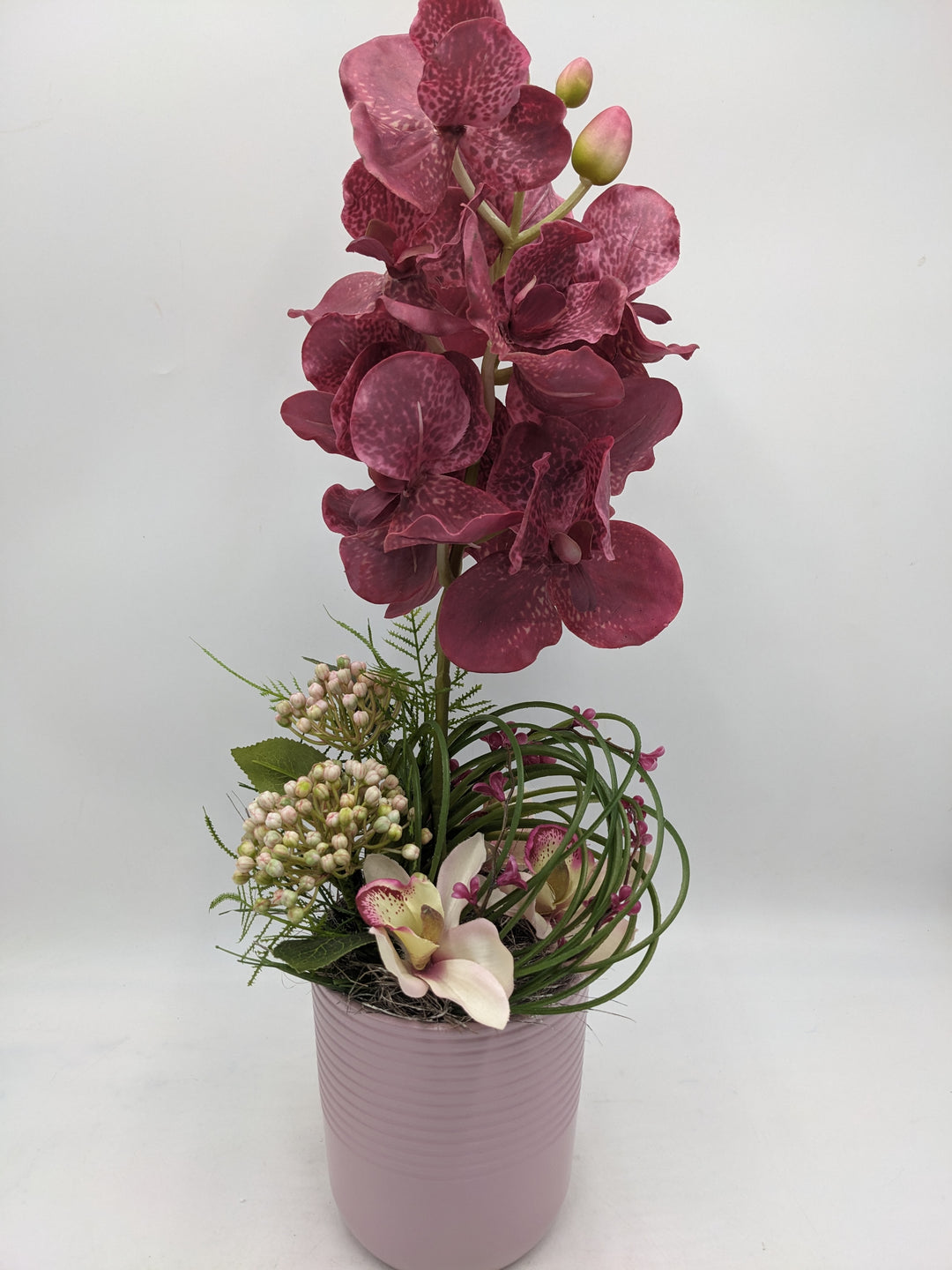 Frühlingsgesteck Orchidee Gräser rosenholz rosa
