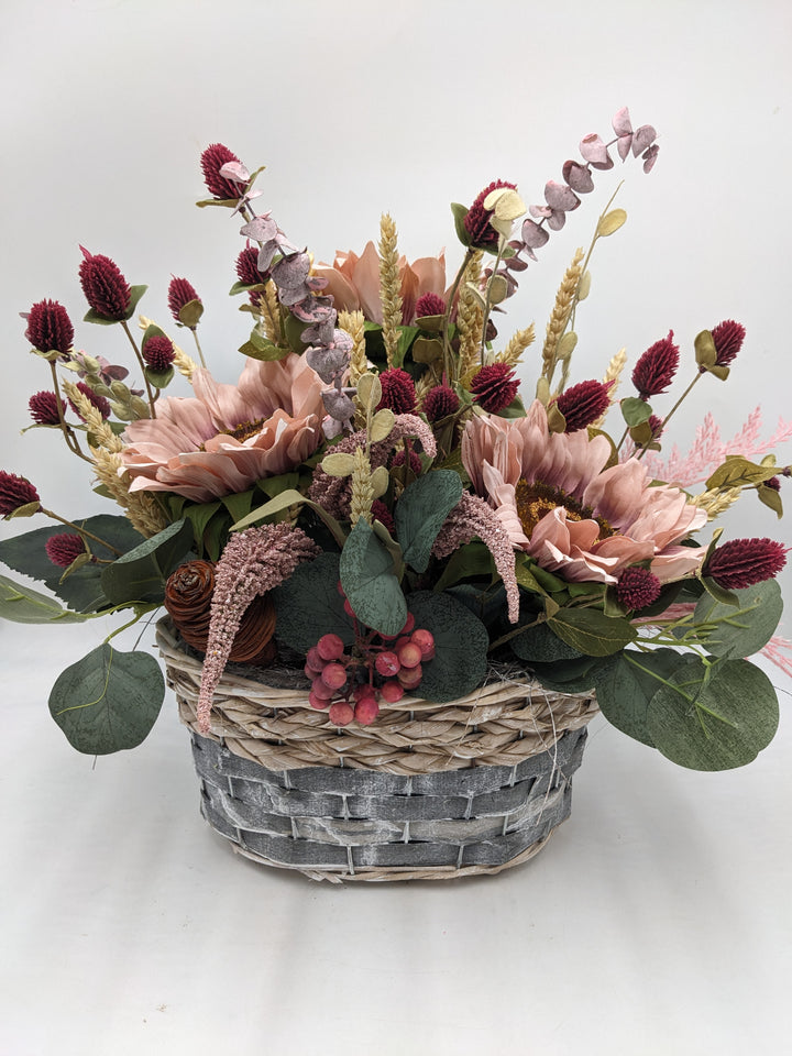 Herbstgesteck Sonnenblumen Heide rosa