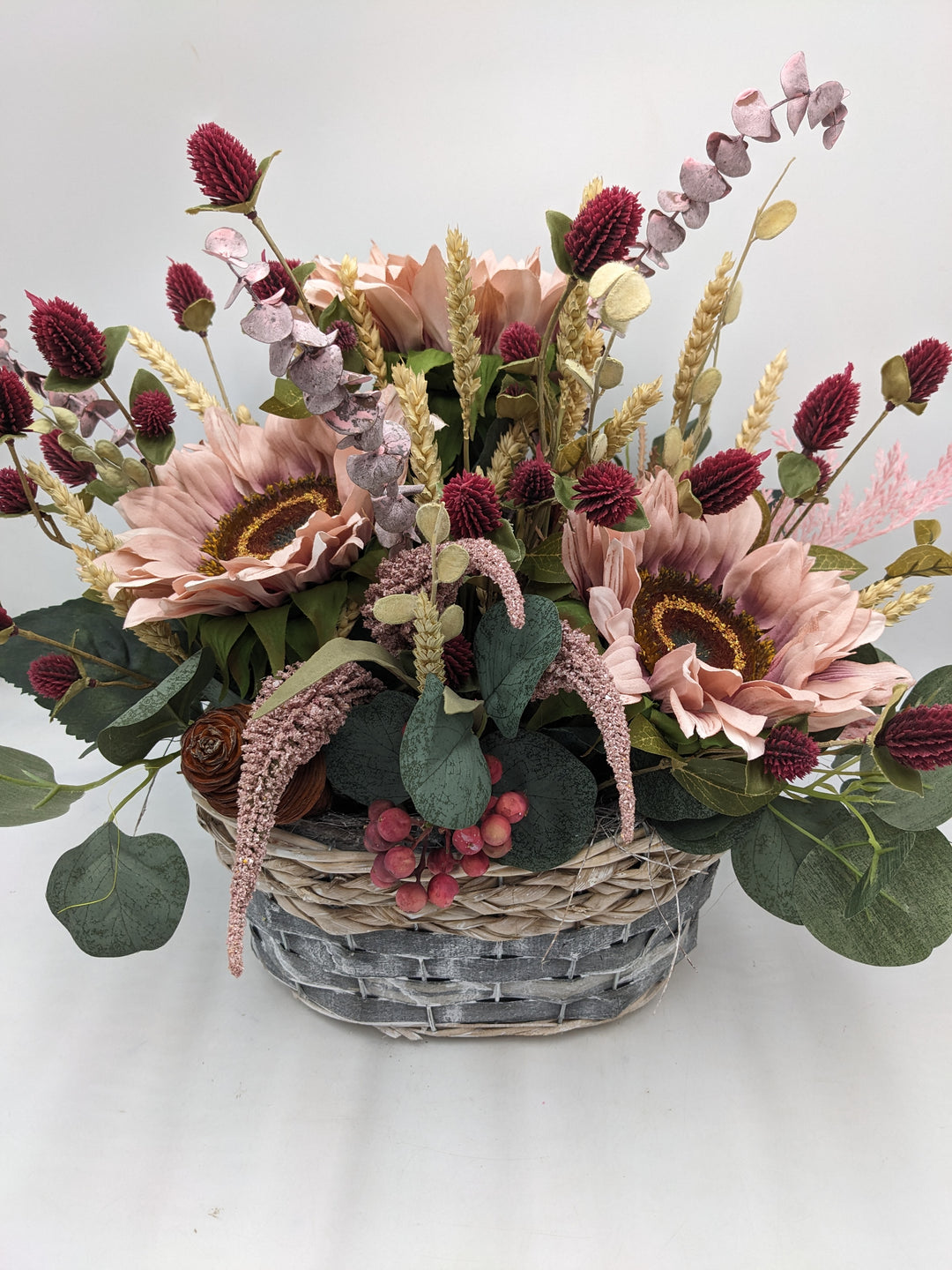 Herbstgesteck Sonnenblumen Heide rosa