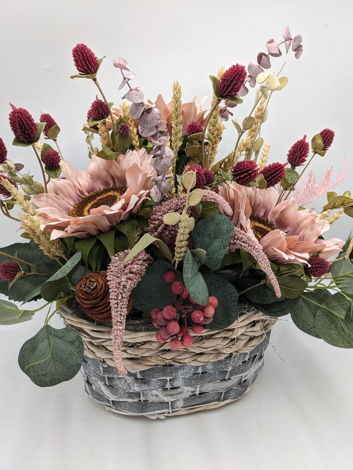 Herbstgesteck Sonnenblumen Heide rosa